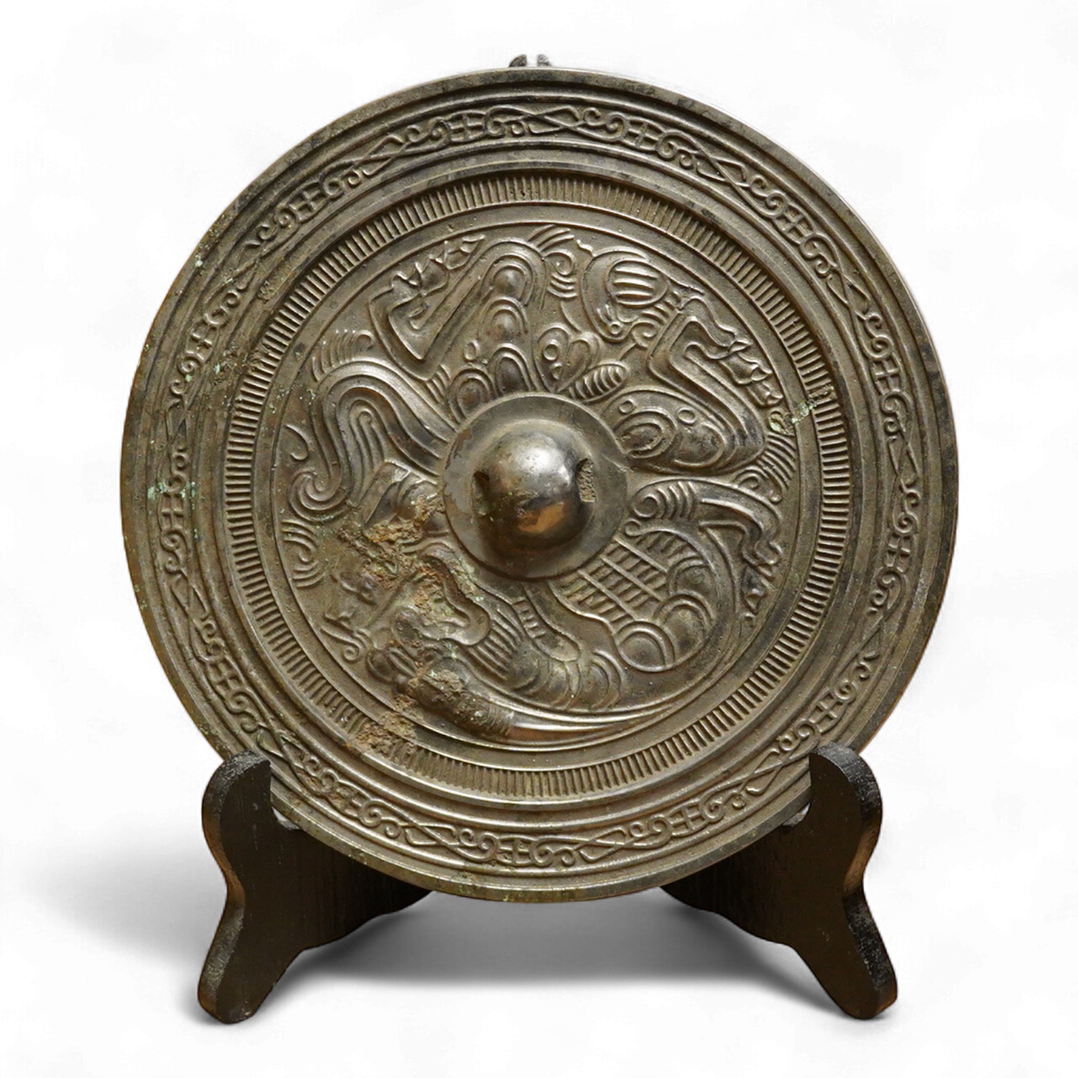 Chinese bronze ‘dragon’ mirror back, 19cm in diameter